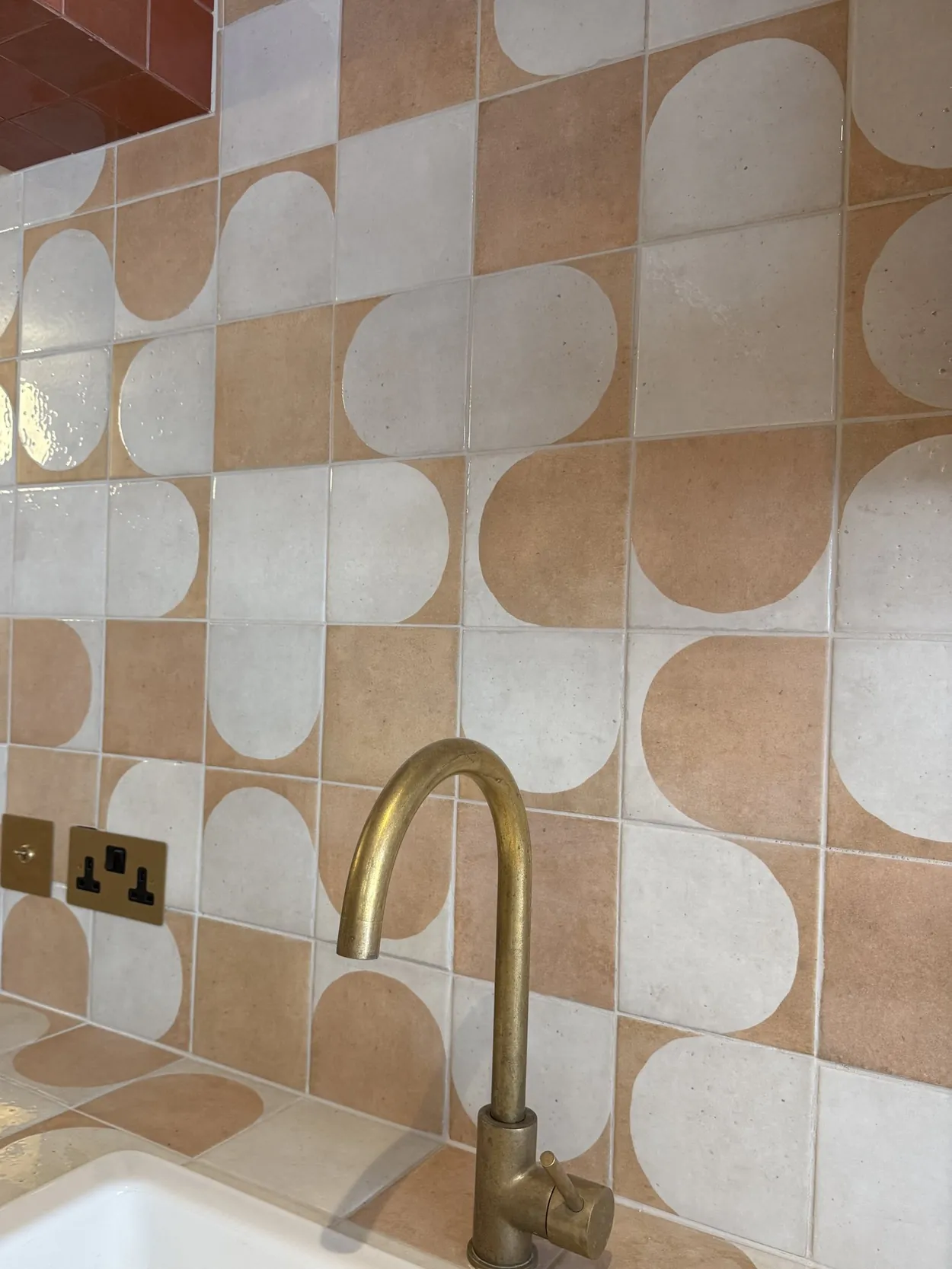 A Walk in the Park, the studio kitchen tiles and solid brass tap